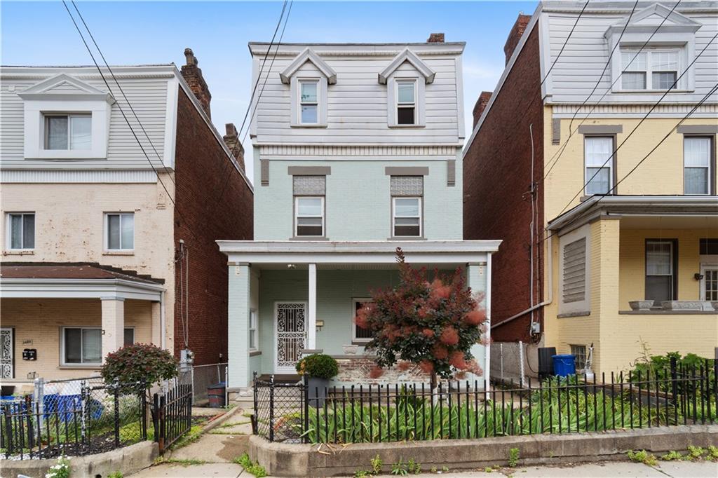3407 Ward Street Pittsburgh, PA 15213 - Photo 1 of 39 a front view of a house with a porch