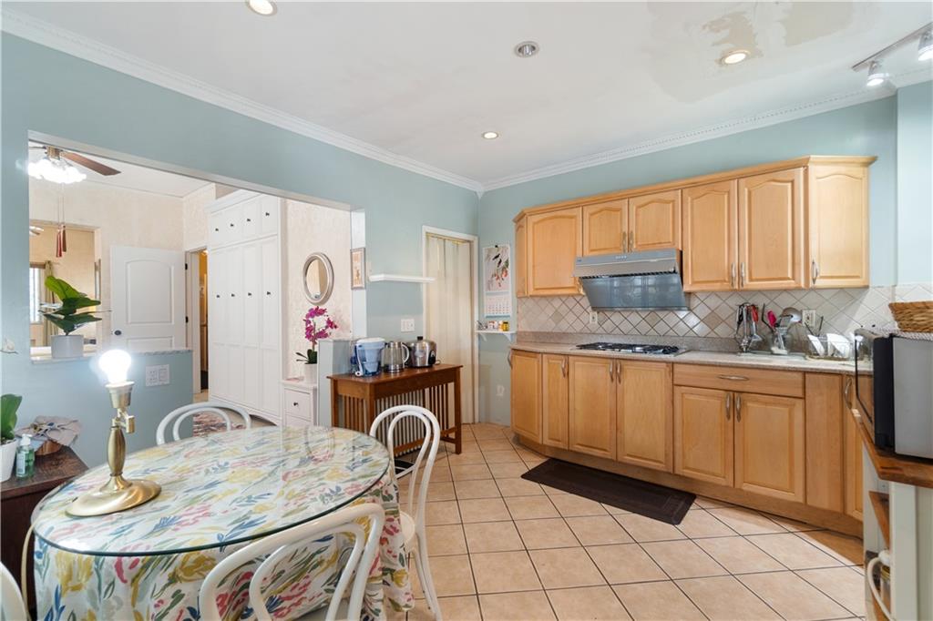 3407 Ward Street Pittsburgh, PA 15213 - Photo 11 of 39 a kitchen with granite countertop a sink appliances cabinets and furniture