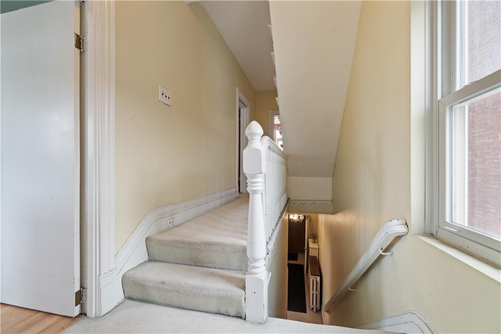 3407 Ward Street Pittsburgh, PA 15213 - Photo 14 of 39 a living room with furniture and a window