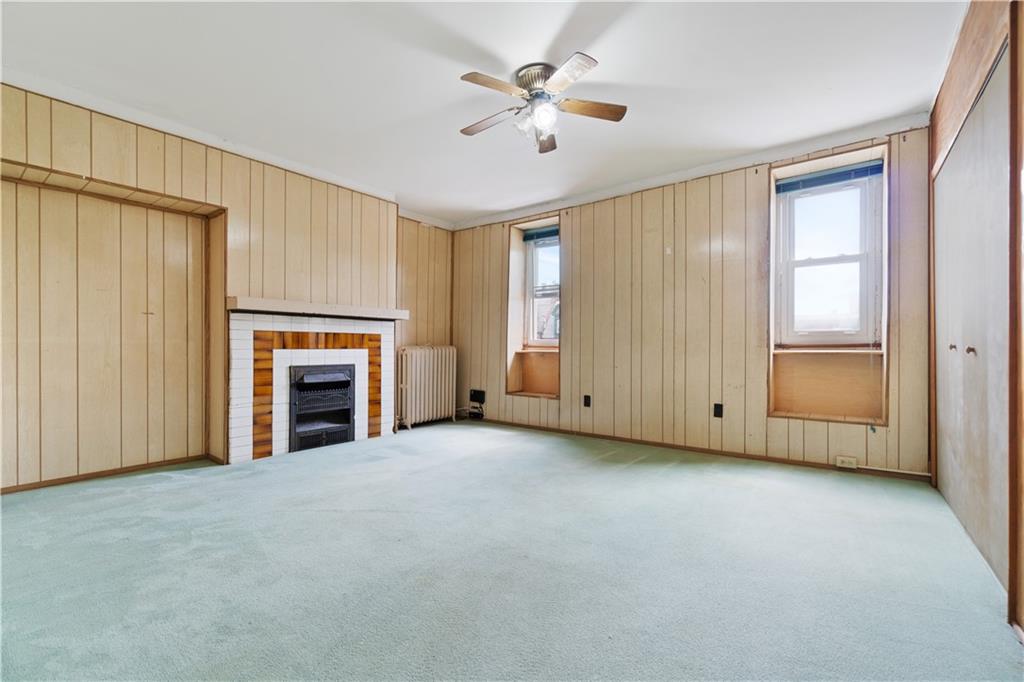 3407 Ward Street Pittsburgh, PA 15213 - Photo 21 of 39 an empty room with windows and chandelier fan