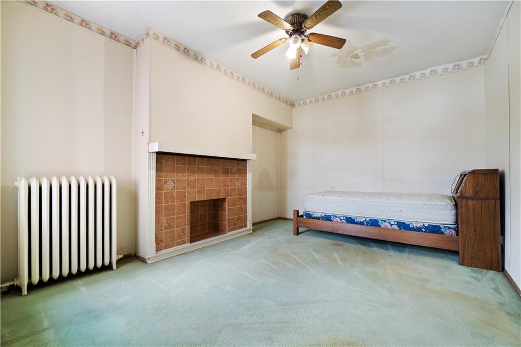 3407 Ward Street Pittsburgh, PA 15213 - Photo 22 of 39 a view of an empty room with a ceiling fan
