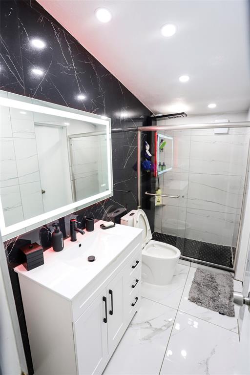 41 Ferguson Lane Frostproof, FL 33843 - Photo 13 of 33 a bathroom with a sink a toilet and shower