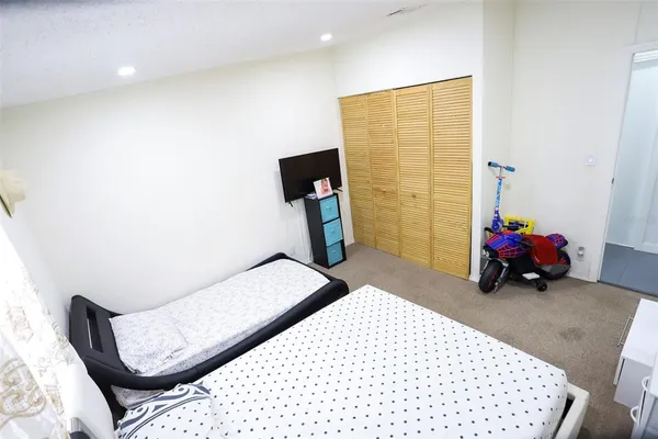 a bed room with a bed and a painting