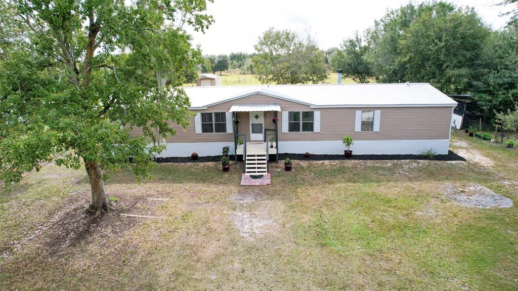 41 Ferguson Lane Frostproof, FL 33843 - Photo 2 of 33 a view of a house with a backyard