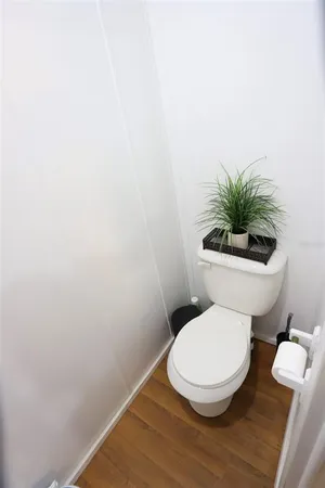 a spacious bathroom with a granite countertop sink a mirror and shower