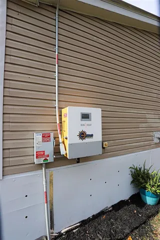 a view of a house with swimming pool and sitting area
