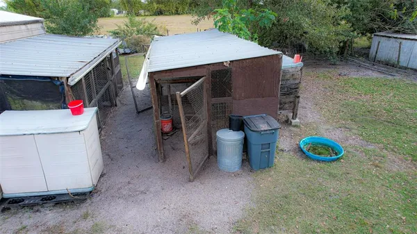 a view of a house with pool and a yard