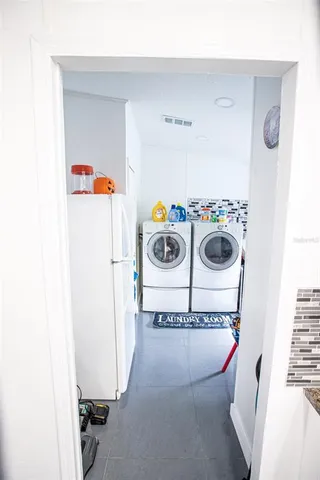 a utility room with dryer and washer