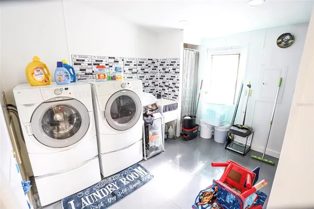 a utility room with dryer and washer