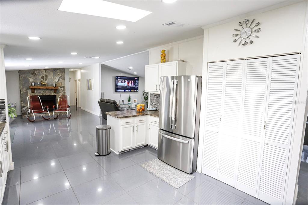 41 Ferguson Lane Frostproof, FL 33843 - Photo 10 of 33 a kitchen with stainless steel appliances a refrigerator and a stove top oven