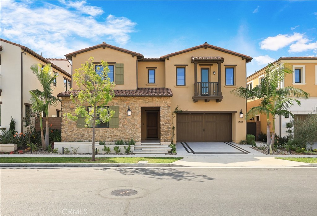108 Salt Spring Irvine, CA 92602 - Photo 1 of 75 a front view of a house with a yard and garage