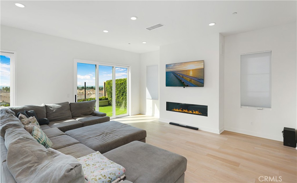 108 Salt Spring Irvine, CA 92602 - Photo 14 of 75 a living room with furniture and a flat screen tv
