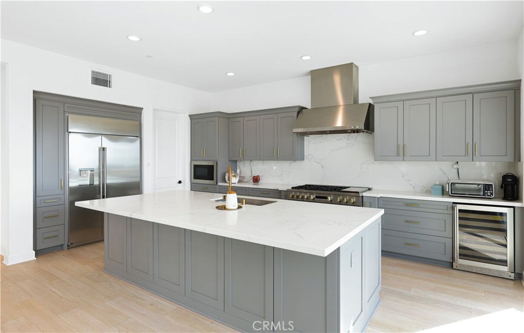 108 Salt Spring Irvine, CA 92602 - Photo 18 of 75 a kitchen with a sink a stove and cabinets
