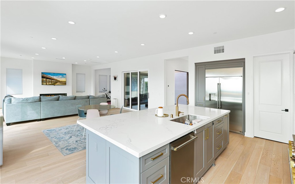 108 Salt Spring Irvine, CA 92602 - Photo 20 of 75 a large kitchen with sink a counter top space and living room