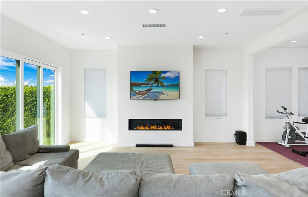 108 Salt Spring Irvine, CA 92602 - Photo 21 of 75 a living room with furniture and a flat screen tv