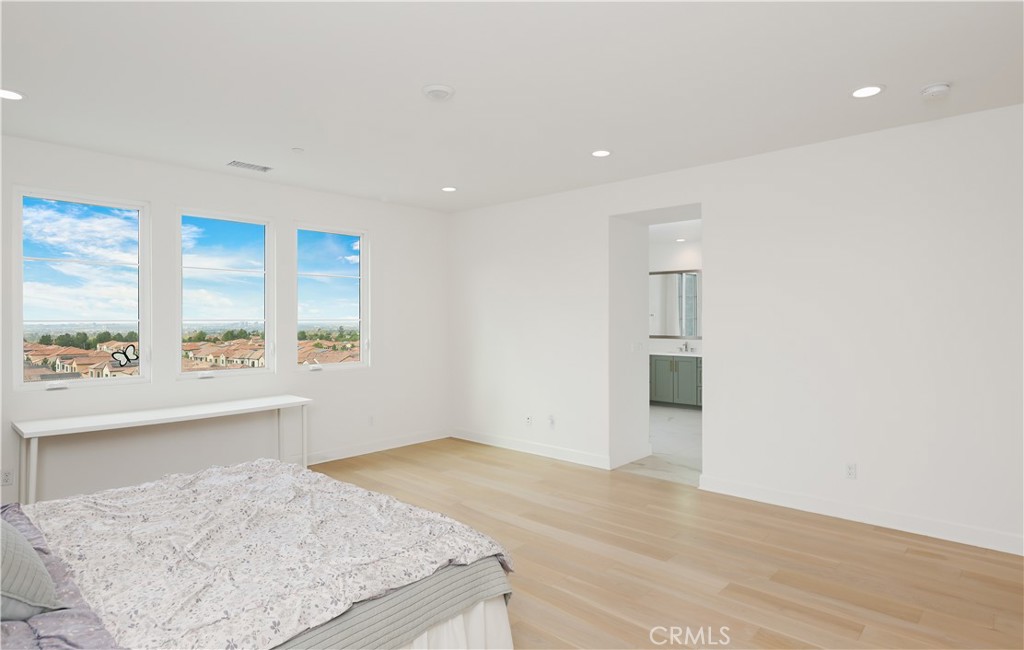 108 Salt Spring Irvine, CA 92602 - Photo 32 of 75 an empty room with wooden floor and windows