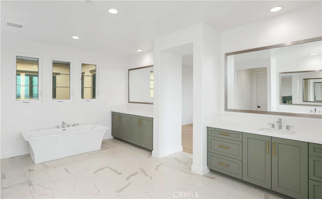 108 Salt Spring Irvine, CA 92602 - Photo 36 of 75 a spacious bathroom with a double vanity sink mirror and bathtub