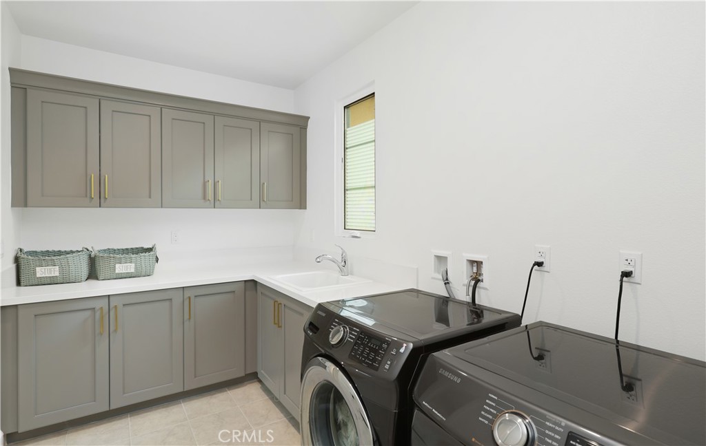 108 Salt Spring Irvine, CA 92602 - Photo 41 of 75 a utility room with cabinets
