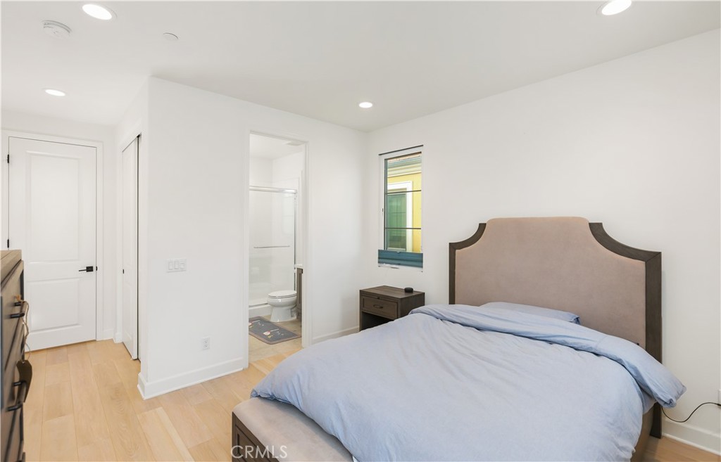 108 Salt Spring Irvine, CA 92602 - Photo 45 of 75 a bedroom with a bed and a chandelier