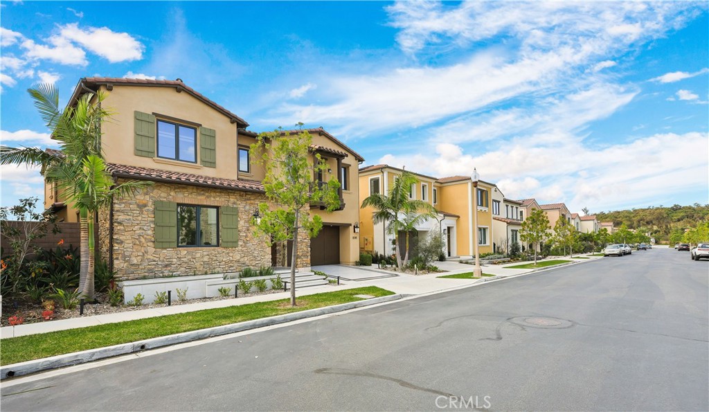 108 Salt Spring Irvine, CA 92602 - Photo 60 of 75 a front view of a house with a yard