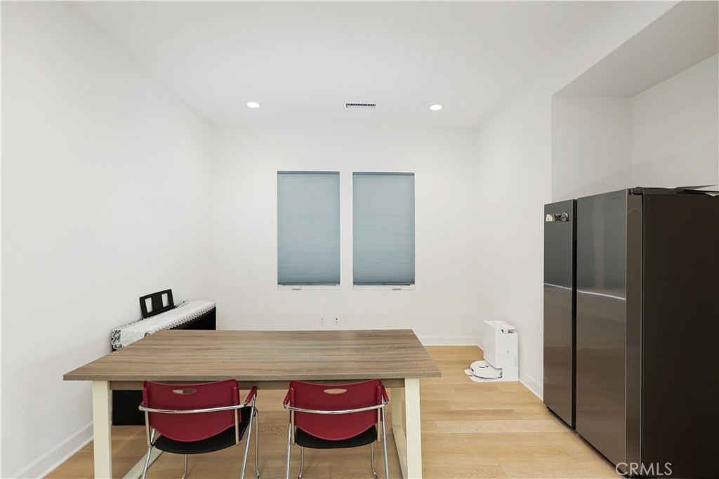 108 Salt Spring Irvine, CA 92602 - Photo 6 of 75 a bathroom with a granite countertop sink and a refrigerator
