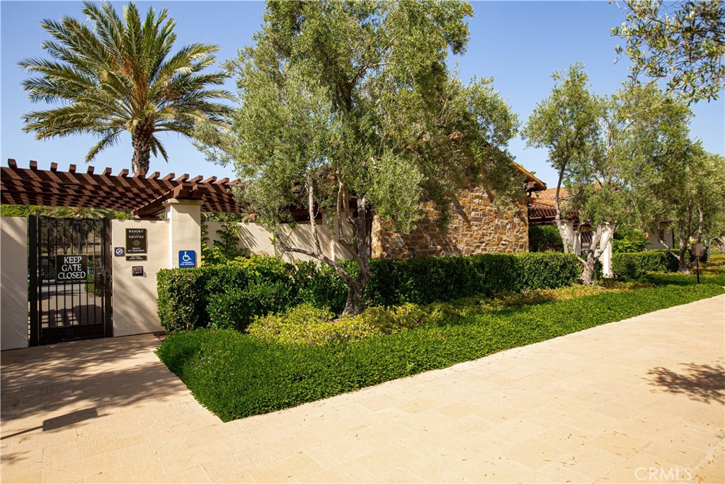 108 Salt Spring Irvine, CA 92602 - Photo 67 of 75 a front view of a house with a garden and a yard