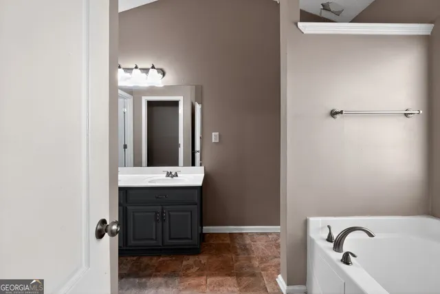 a bathroom with a sink and a bathtub