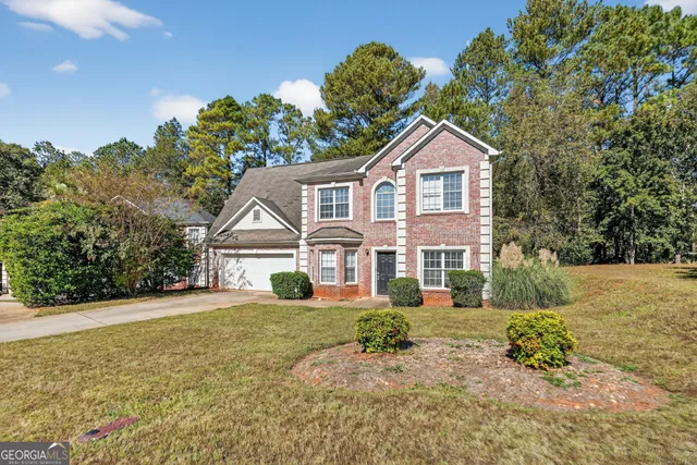 a house with trees in the background