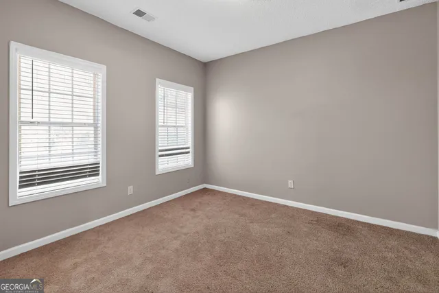 an empty room with windows