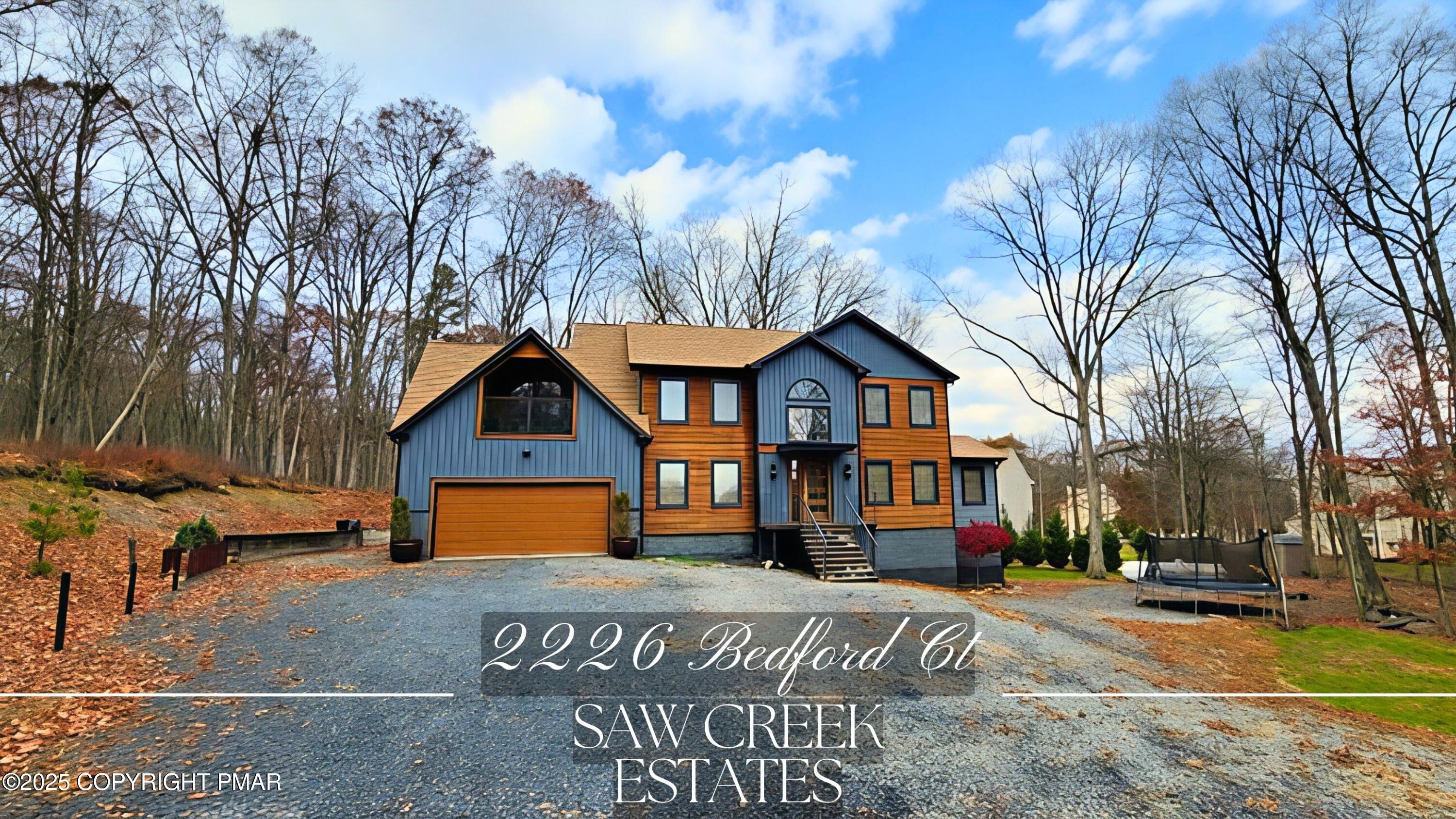 2226 Bedford Court Bushkill, PA 18371 - Photo 1 of 79 a front view of a house with a yard