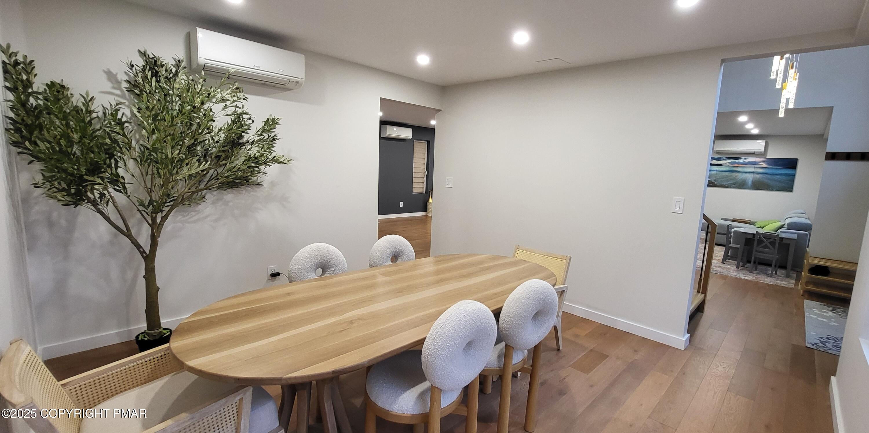 2226 Bedford Court Bushkill, PA 18371 - Photo 20 of 79 a dining room with furniture and wooden floor
