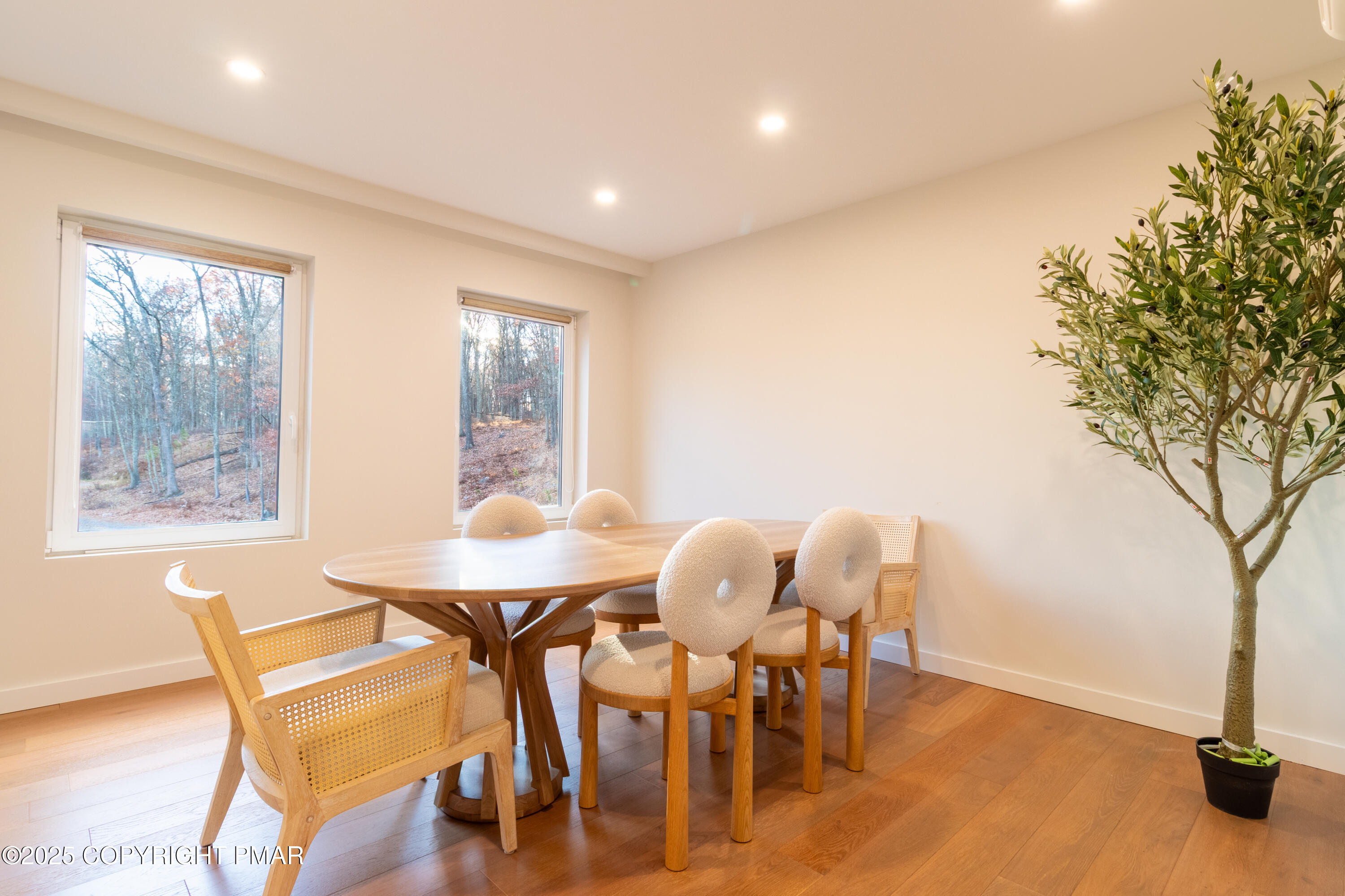 2226 Bedford Court Bushkill, PA 18371 - Photo 21 of 79 a view of a dining room with furniture and wooden floor