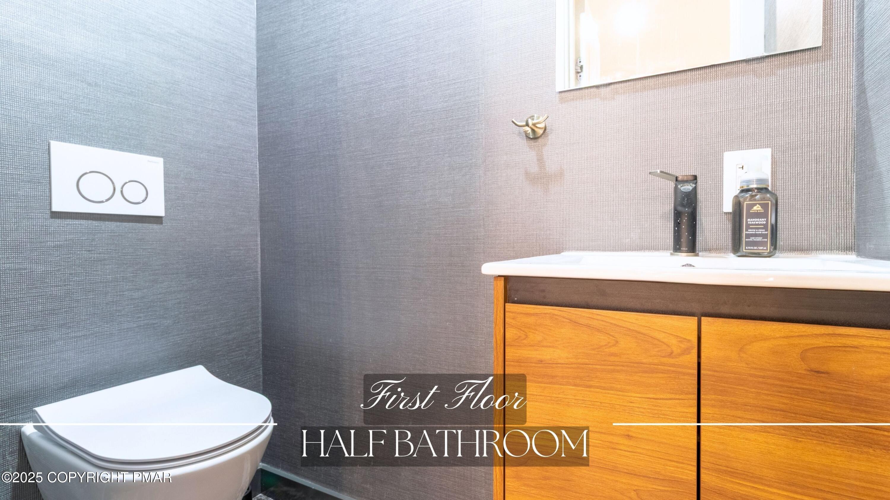 2226 Bedford Court Bushkill, PA 18371 - Photo 22 of 79 a bathroom with a toilet sink and vanity