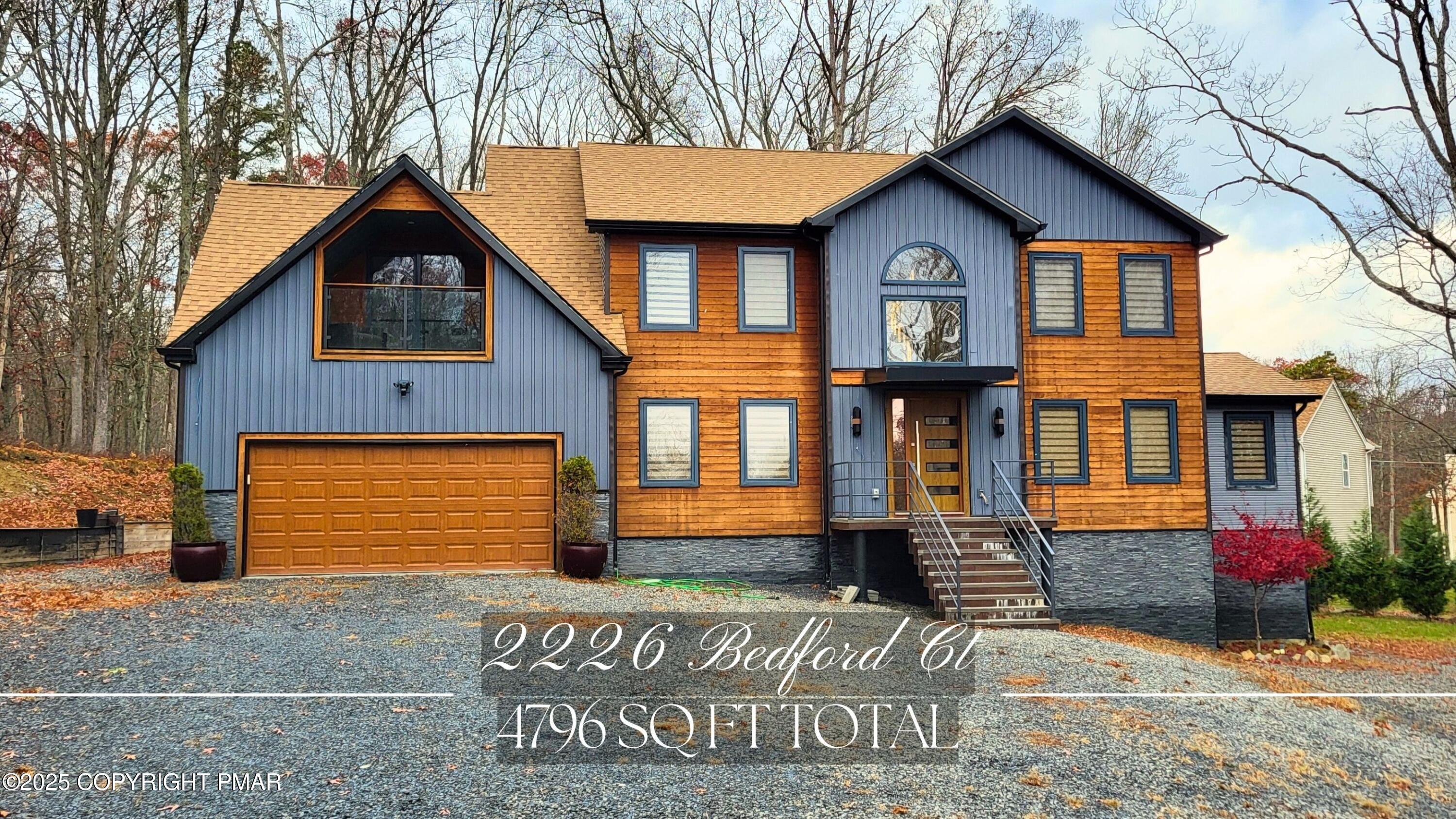 2226 Bedford Court Bushkill, PA 18371 - Photo 3 of 79 a front view of a house with a yard