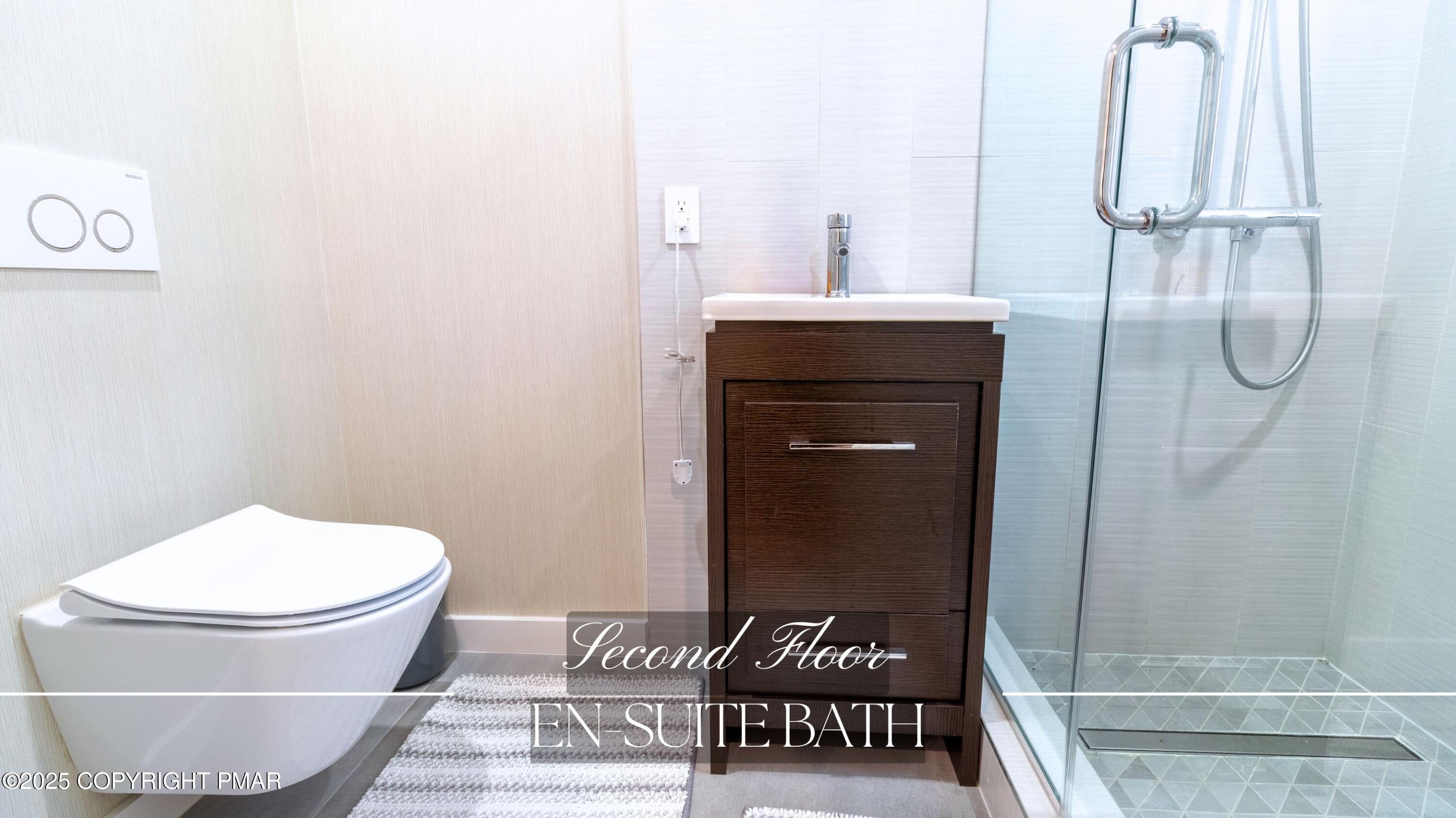 2226 Bedford Court Bushkill, PA 18371 - Photo 35 of 79 a bathroom with a toilet and a sink