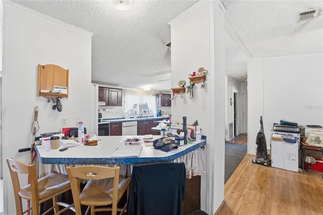 a kitchen with a table and chairs in it