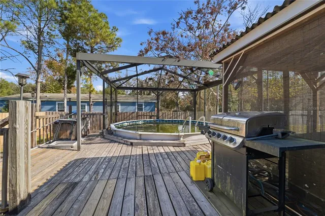 a view of a swimming pool with a patio