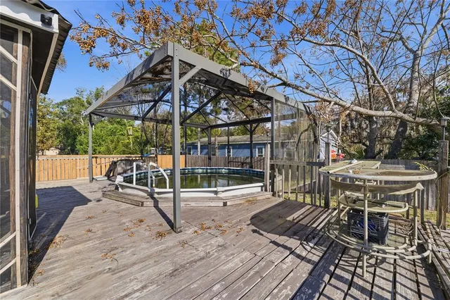 a view of a chairs and table in the patio