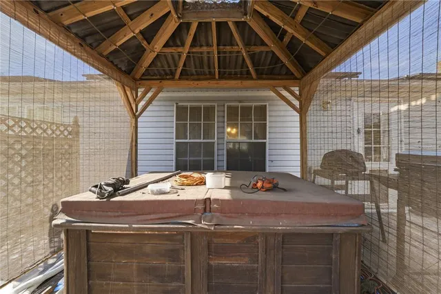 a table and chairs in front of a house