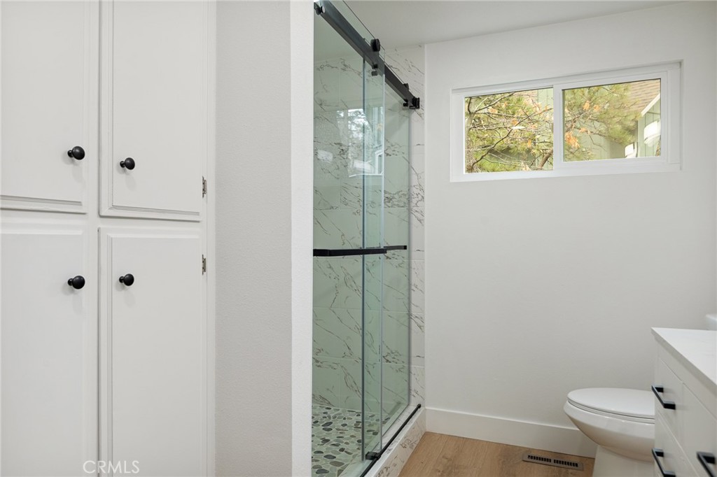 1076 Grass Valley Road Lake Arrowhead, CA 92352 - Photo 21 of 35 Walk in shower tiled with stoned