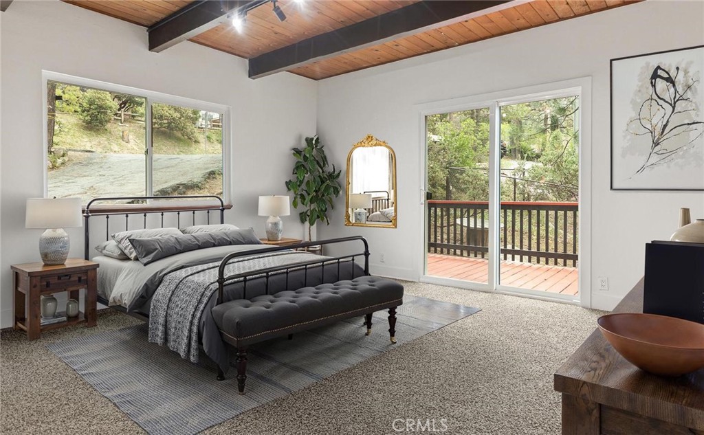 1076 Grass Valley Road Lake Arrowhead, CA 92352 - Photo 3 of 35 Primary bedroom tucked away right off the living room (Virtually staged)