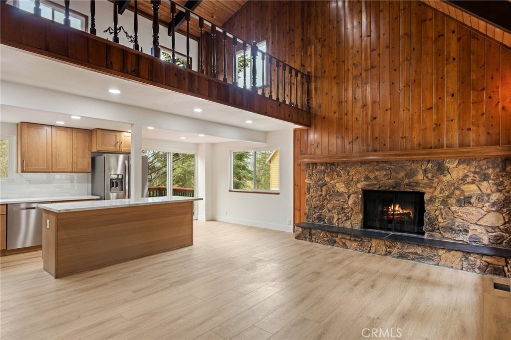 1076 Grass Valley Road Lake Arrowhead, CA 92352 - Photo 5 of 35 Main living area with fireplace, kitchen, dining combined
