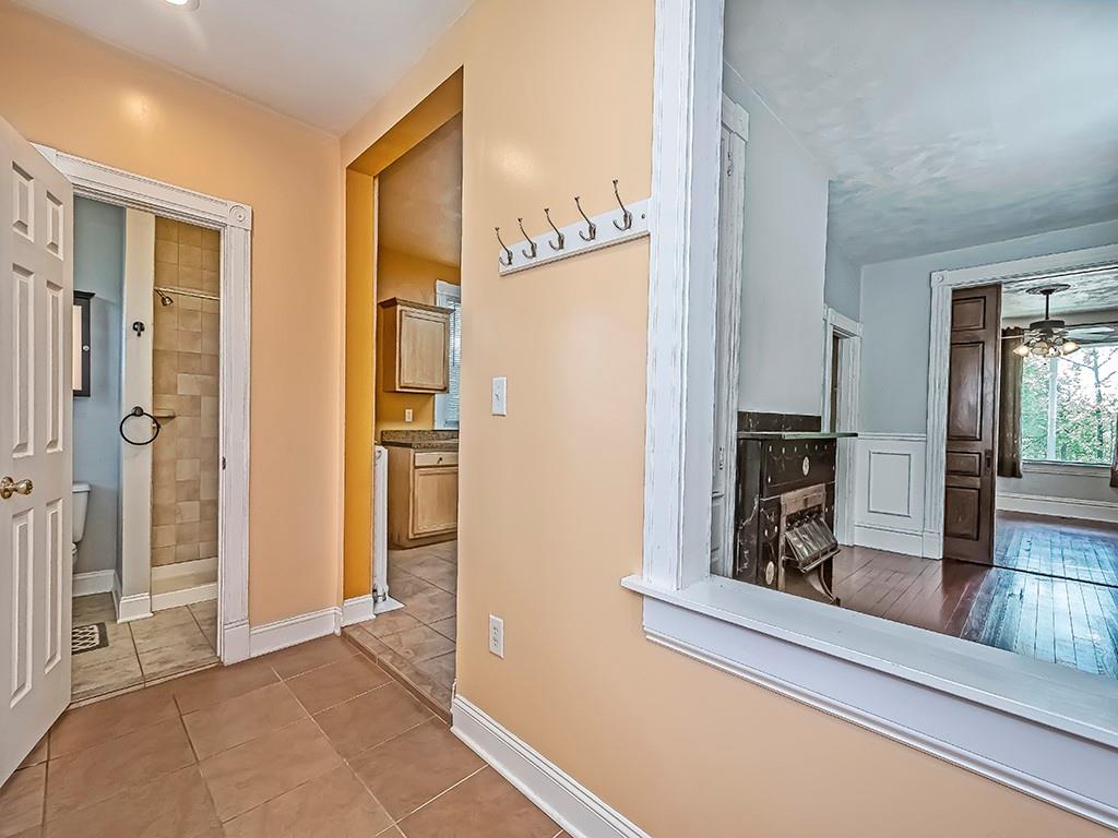 449 Library Avenue Carnegie, PA 15106 - Photo 18 of 22 a view of a hallway with wooden floor and dining room
