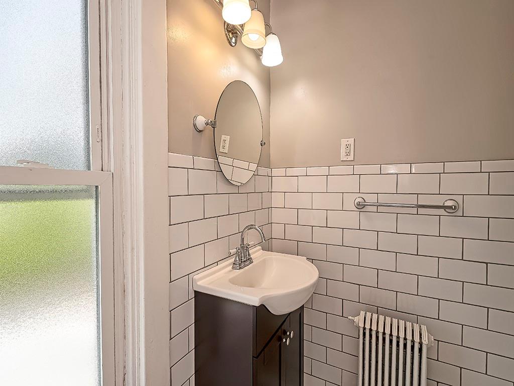 449 Library Avenue Carnegie, PA 15106 - Photo 20 of 22 a bathroom with a sink a mirror and vanity