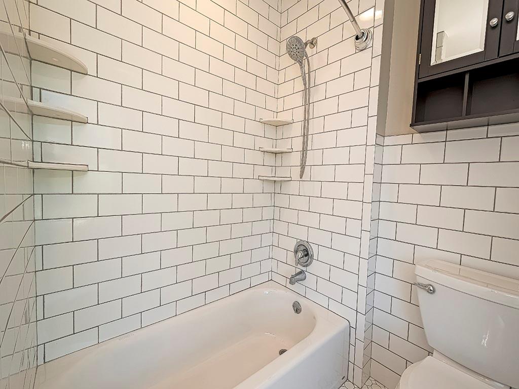 449 Library Avenue Carnegie, PA 15106 - Photo 21 of 22 a bathroom with a bathtub and shower