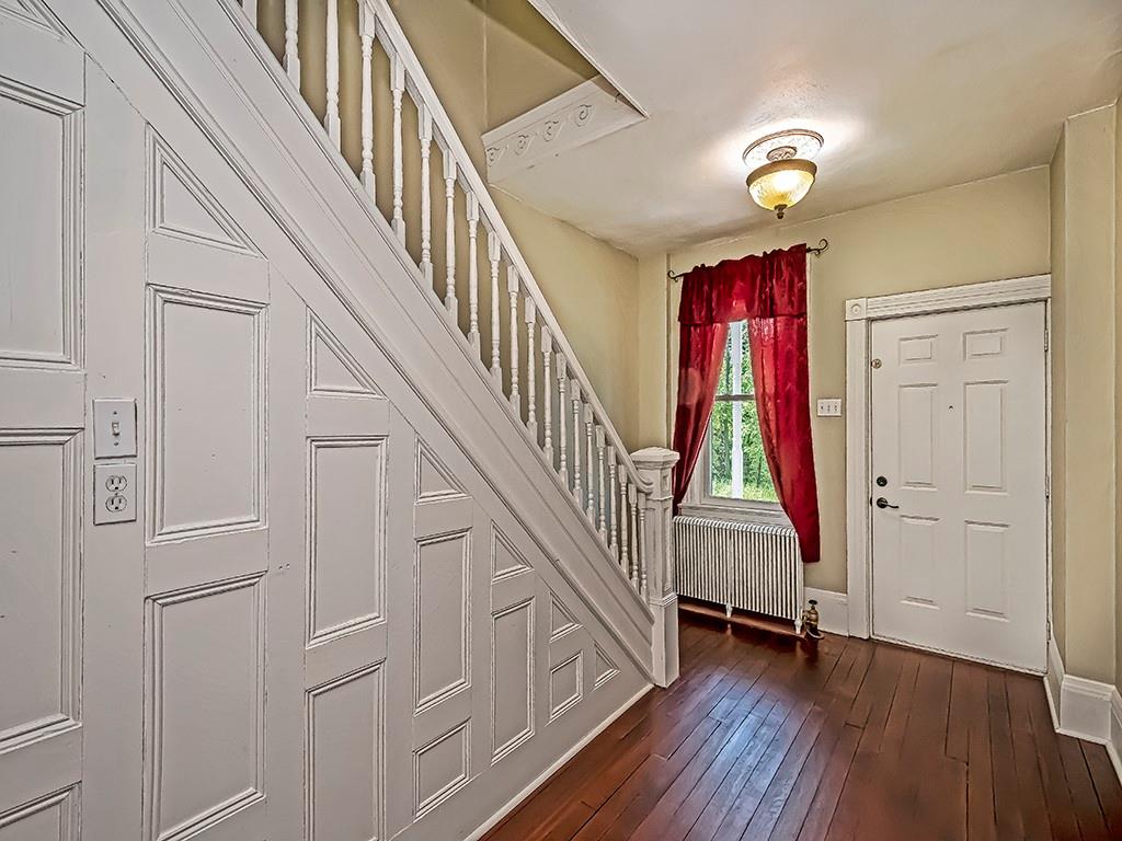 449 Library Avenue Carnegie, PA 15106 - Photo 4 of 22 a view of front door with hallway and wooden floor
