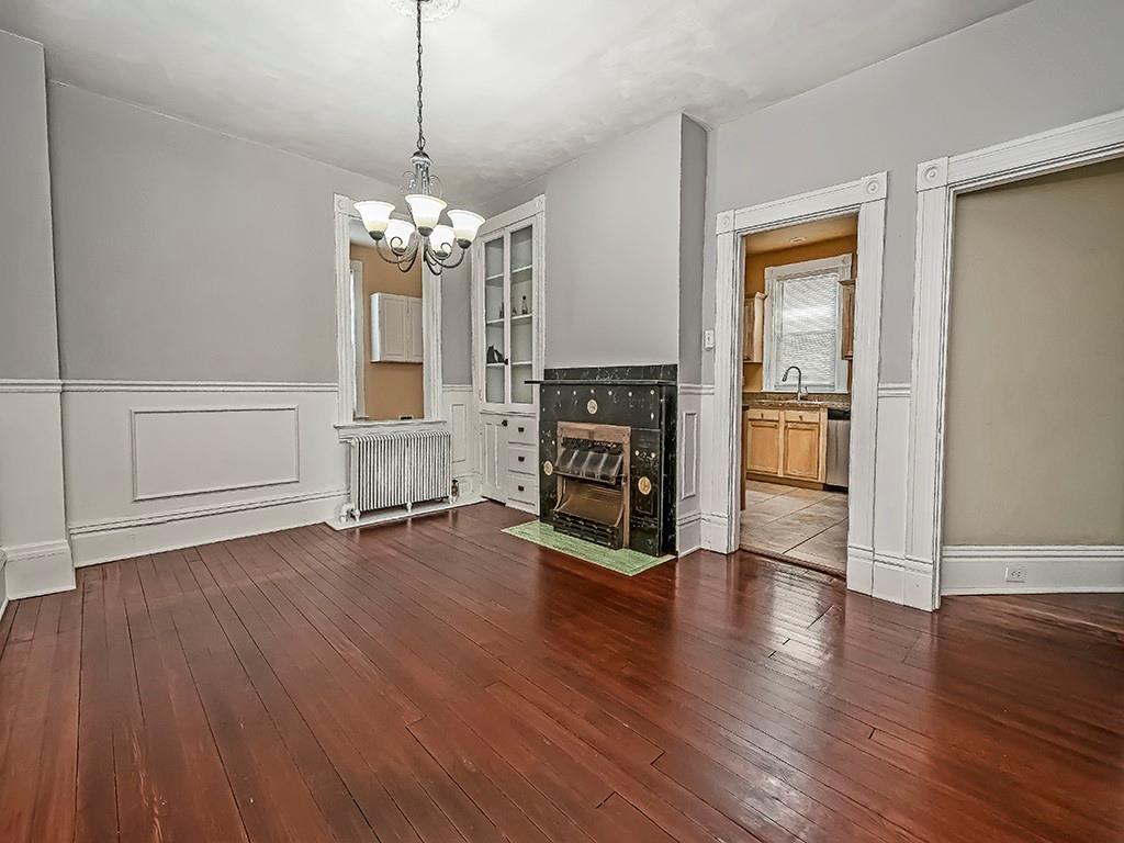 449 Library Avenue Carnegie, PA 15106 - Photo 7 of 22 a view of a livingroom with wooden floor and a ceiling fan