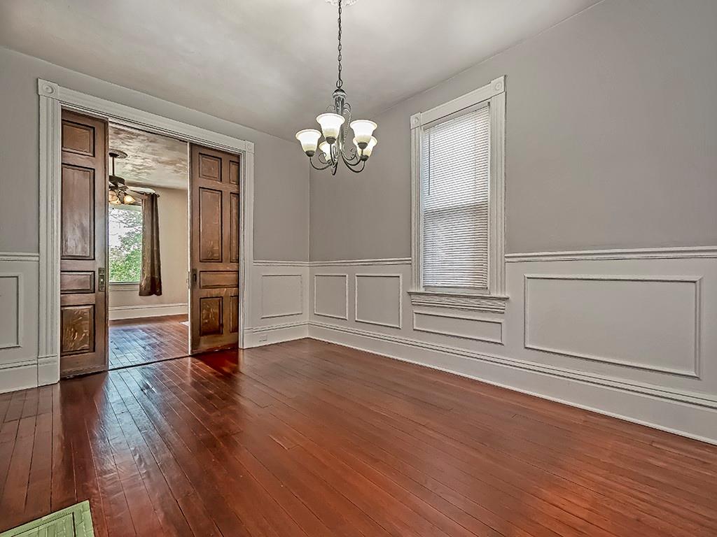449 Library Avenue Carnegie, PA 15106 - Photo 8 of 22 a view of an empty room with wooden floor and a window