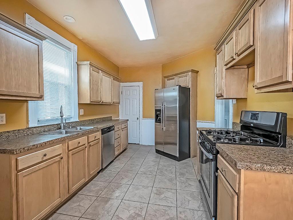 449 Library Avenue Carnegie, PA 15106 - Photo 10 of 22 a kitchen with stainless steel appliances granite countertop a refrigerator stove and sink