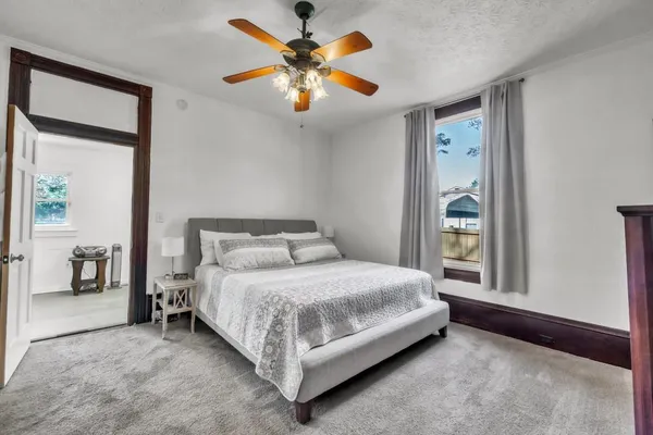 a bedroom with a bed and a television